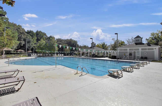 4227 Sawgrass Dr, North Charleston, SC 29420 - community pool with a patio area and view of scattered trees