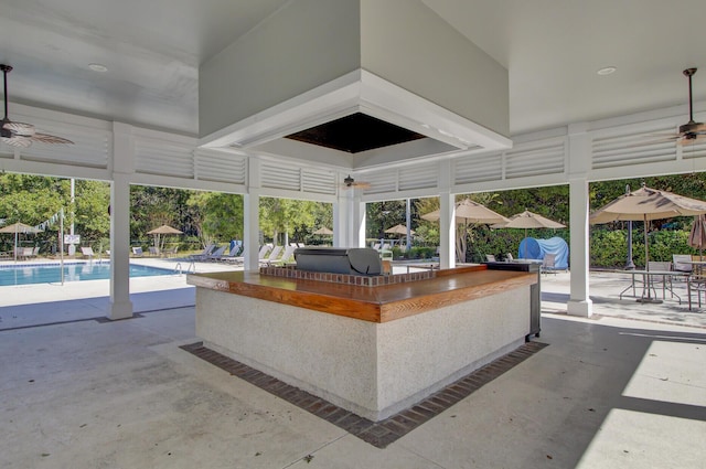 4227 Sawgrass Dr, North Charleston, SC 29420 - view of patio with exterior bar, a ceiling fan, an outdoor pool, and a grill