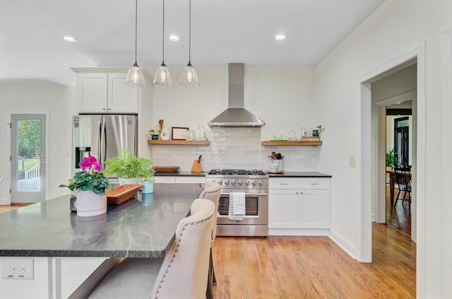 4227 Sawgrass Dr, North Charleston, SC 29420 - kitchen with wall chimney exhaust hood, appliances with stainless steel finishes, open shelves, decorative backsplash, and recessed lighting