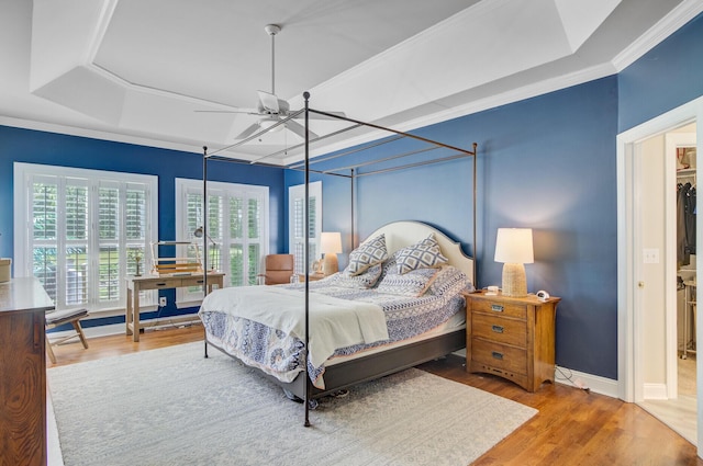 4227 Sawgrass Dr, North Charleston, SC 29420 - bedroom featuring a raised ceiling, wood finished floors, baseboards, ornamental molding, and ceiling fan