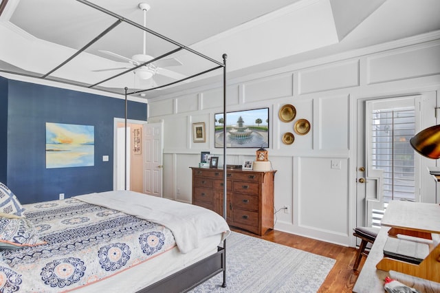 4227 Sawgrass Dr, North Charleston, SC 29420 - bedroom with a decorative wall, wood finished floors, and a ceiling fan