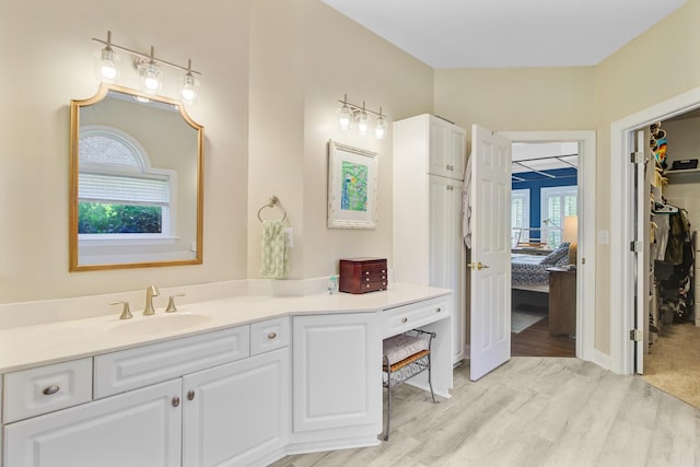 4227 Sawgrass Dr, North Charleston, SC 29420 - ensuite bathroom featuring vanity, wood finished floors, and a spacious closet