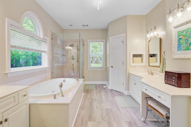 4227 Sawgrass Dr, North Charleston, SC 29420 - full bathroom featuring a stall shower, vanity, healthy amount of natural light, and a tub with jets