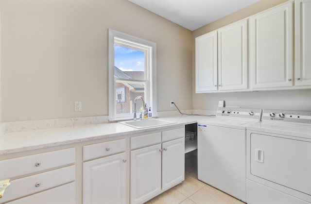 4227 Sawgrass Dr, North Charleston, SC 29420 - laundry room featuring independent washer and dryer, cabinet space, and light tile patterned flooring