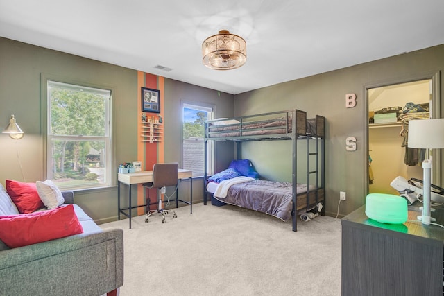 4227 Sawgrass Dr, North Charleston, SC 29420 - carpeted bedroom featuring a desk, baseboards, and a spacious closet