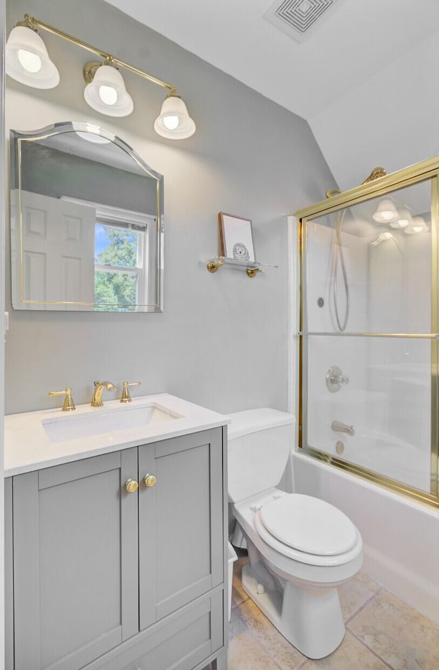 4227 Sawgrass Dr, North Charleston, SC 29420 - bathroom with vanity, toilet, vaulted ceiling, and combined bath / shower with glass door