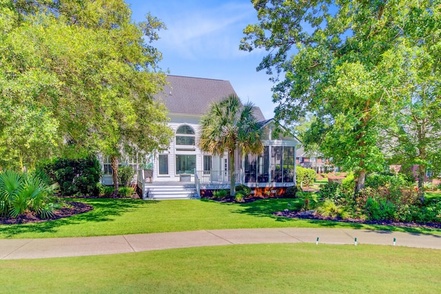 4227 Sawgrass Dr, North Charleston, SC 29420 - view of front of house featuring a front lawn and a sunroom