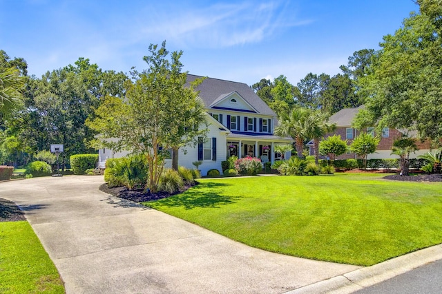 4227 Sawgrass Dr, North Charleston, SC 29420 - view of front of house featuring driveway, a front lawn, and a porch