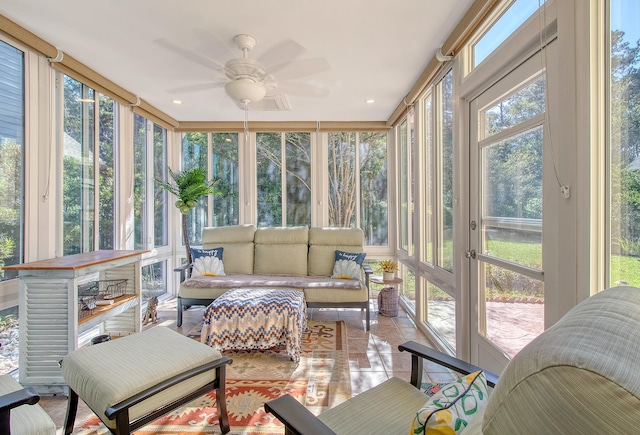 sunroom featuring ceiling fan