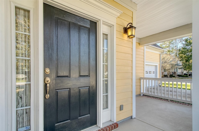 doorway to property with covered porch