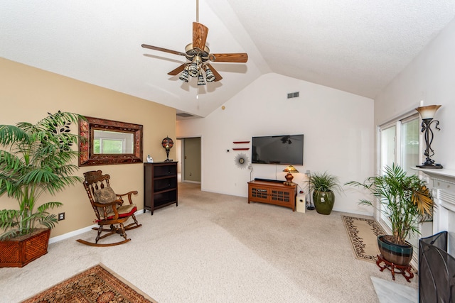 sitting room featuring vaulted ceiling, ceiling fan, and carpet floors