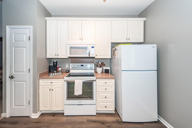 kitchen featuring white cabinets, dark hardwood / wood-style flooring, and white appliances