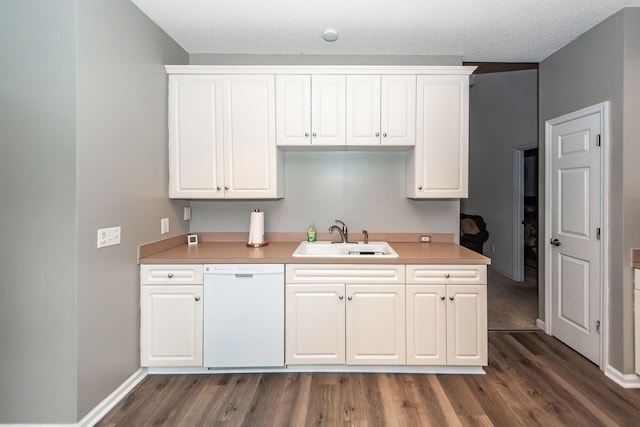 kitchen featuring sink, white dishwasher, dark wood-type flooring, and white cabinets