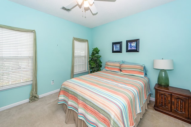 bedroom featuring ceiling fan and light colored carpet