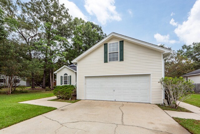 front of property featuring a garage and a front lawn