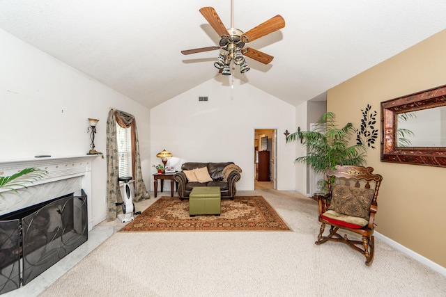 living room with a high end fireplace, vaulted ceiling, light carpet, and ceiling fan