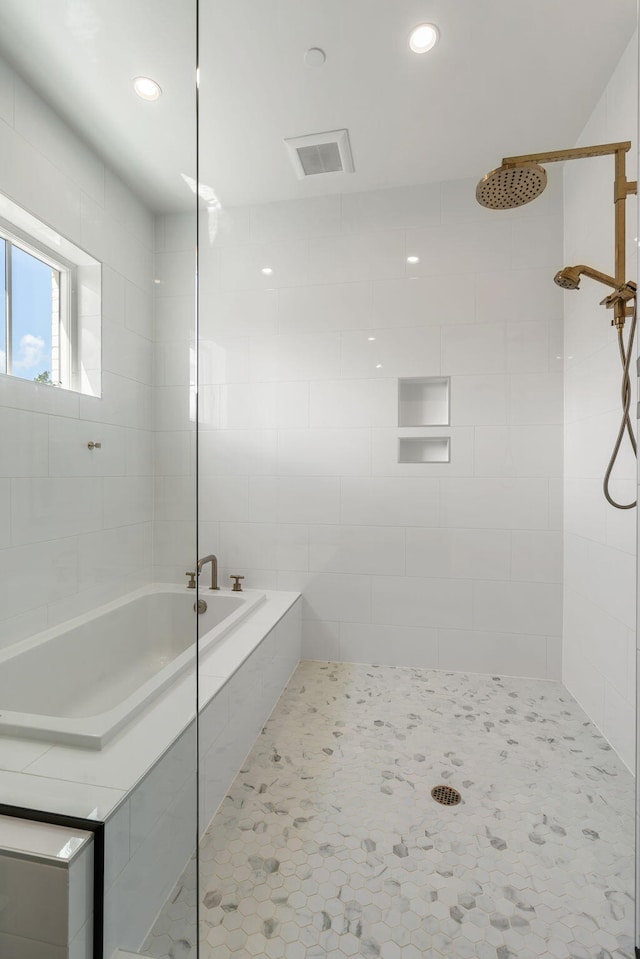 full bathroom with recessed lighting, visible vents, a tile shower, a bath, and tile patterned floors