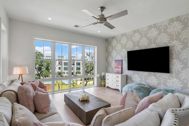 living room featuring recessed lighting, visible vents, a ceiling fan, wood finished floors, and wallpapered walls