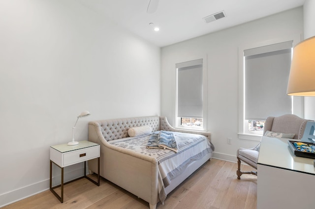 bedroom with light wood-style floors, baseboards, visible vents, and recessed lighting