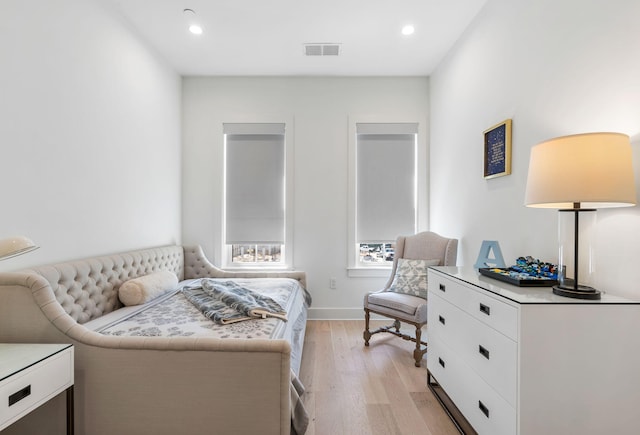 bedroom with light wood-type flooring, baseboards, visible vents, and recessed lighting