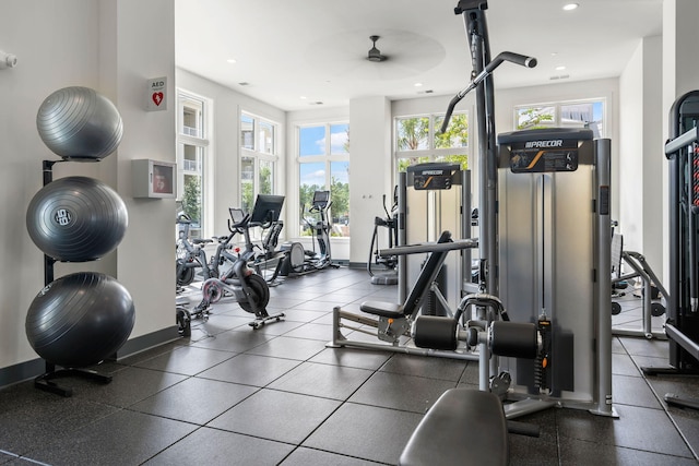 gym featuring baseboards and recessed lighting