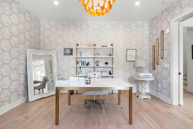 office featuring baseboards, an inviting chandelier, light wood-style flooring, and wallpapered walls