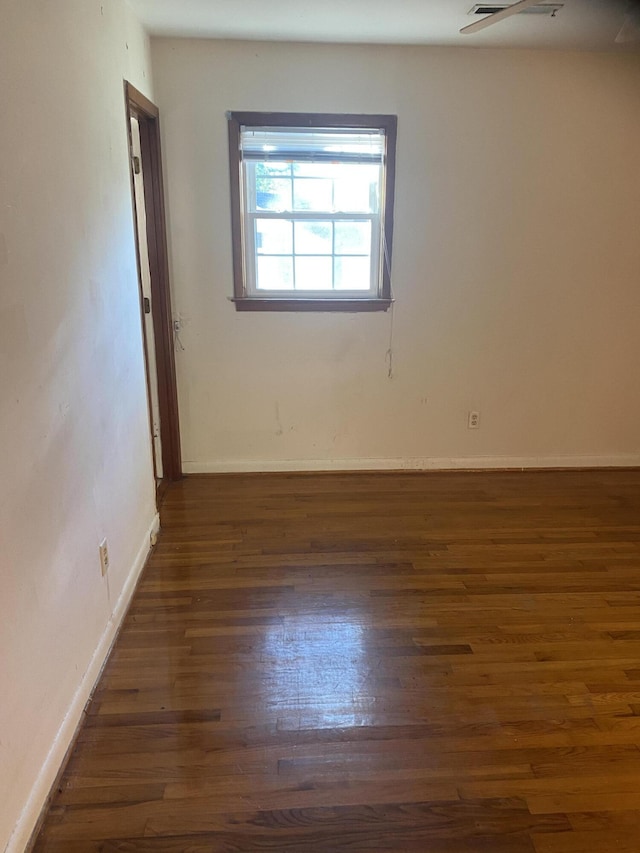 spare room featuring dark hardwood / wood-style floors