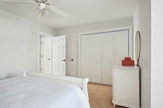 bedroom with light carpet and ceiling fan