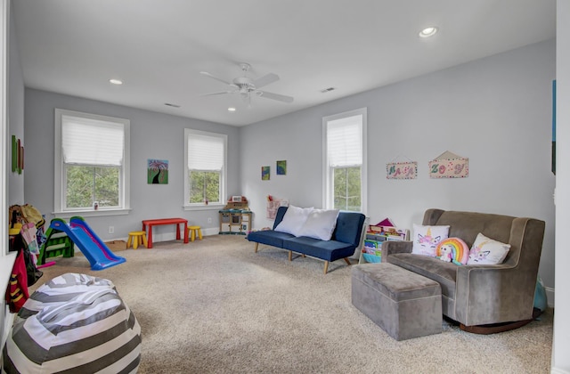 living room featuring baseboards, recessed lighting, carpet flooring, a ceiling fan, and visible vents