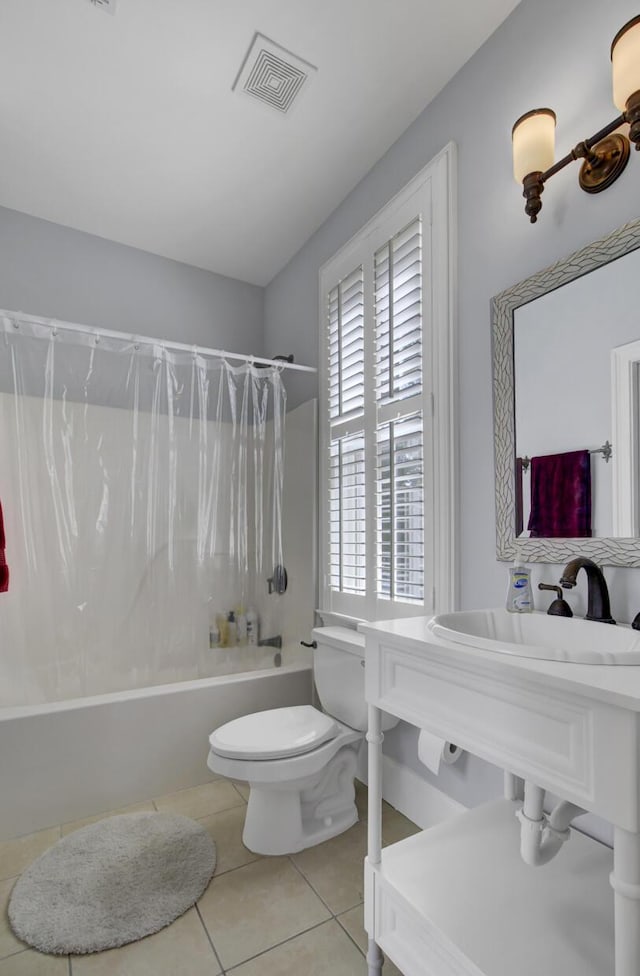 full bath with shower / bath combo, tile patterned floors, visible vents, and toilet