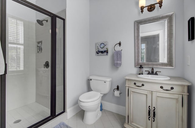 full bath with baseboards, toilet, a shower stall, vanity, and tile patterned floors