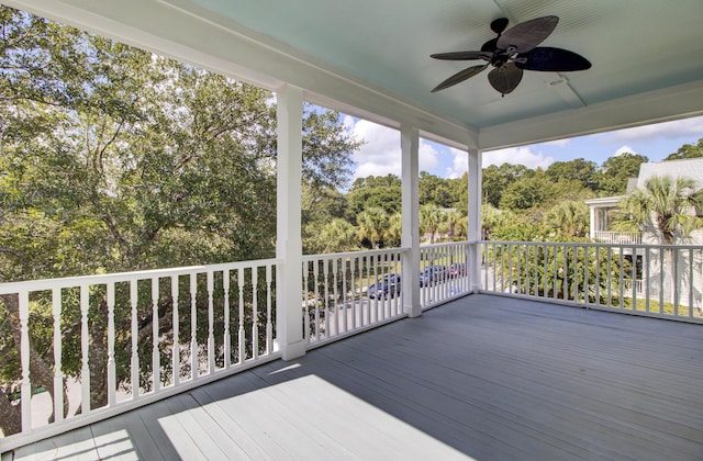wooden deck featuring a ceiling fan