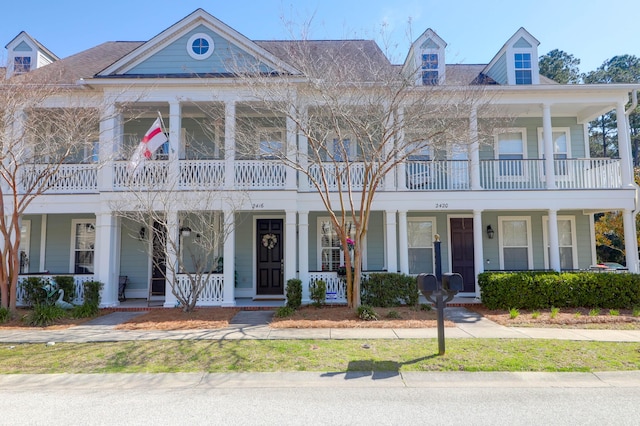 view of front facade with a porch and a balcony