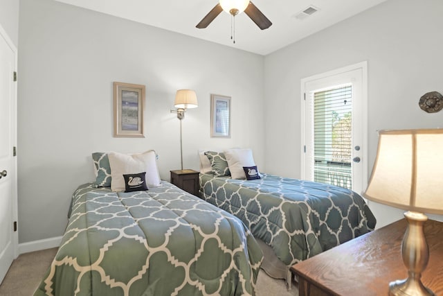 carpeted bedroom featuring a ceiling fan, access to exterior, baseboards, and visible vents