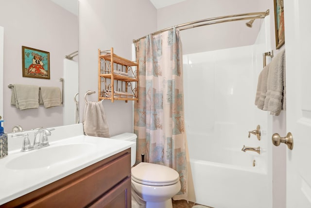 bathroom with shower / tub combo with curtain, vanity, and toilet