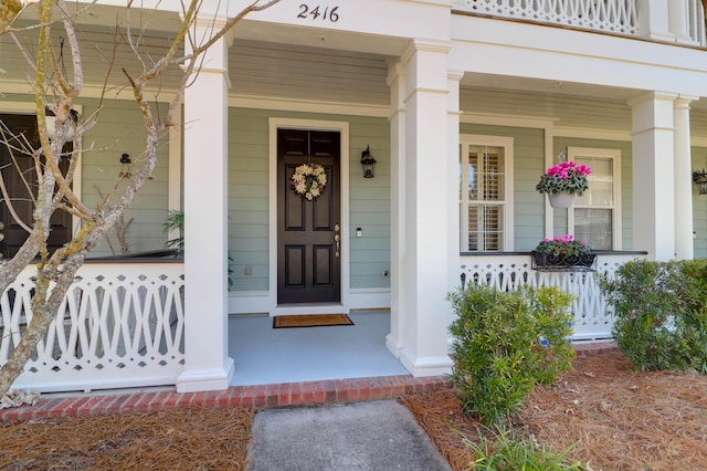 property entrance featuring covered porch