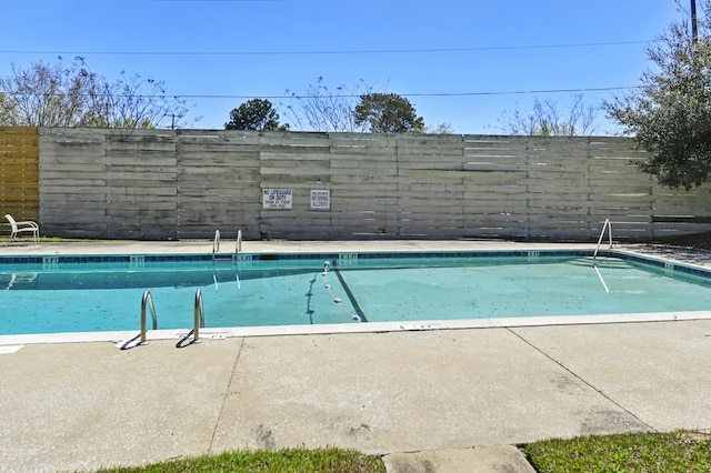 community pool with fence