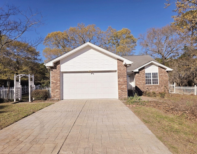 1575 Cottage Dr, Summerton, SC 29148 - ranch-style home with an attached garage, fence, driveway, and brick siding