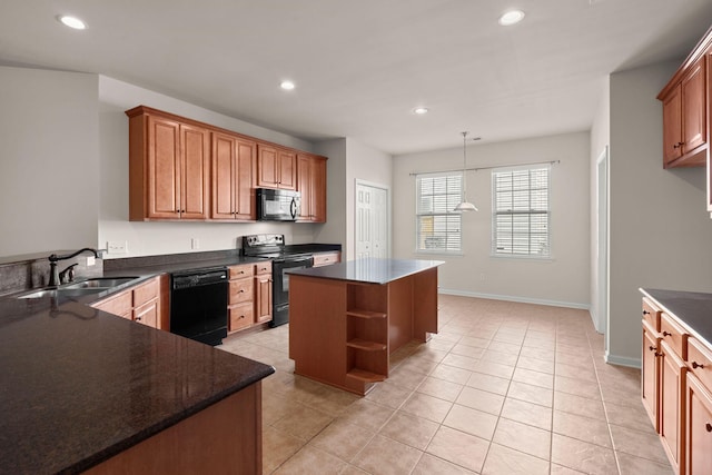 kitchen featuring light tile patterned flooring, a kitchen island, decorative light fixtures, sink, and black appliances