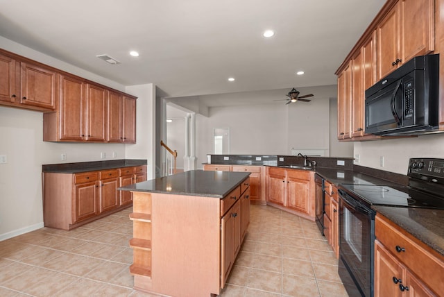 kitchen with sink, a center island, light tile patterned floors, ceiling fan, and black appliances