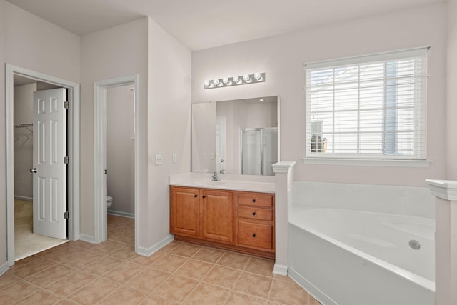 full bathroom with vanity, tile patterned floors, plus walk in shower, and toilet