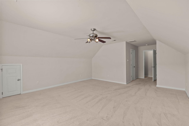 bonus room featuring vaulted ceiling, light colored carpet, and ceiling fan