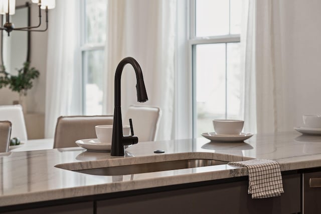 details featuring a notable chandelier and a sink