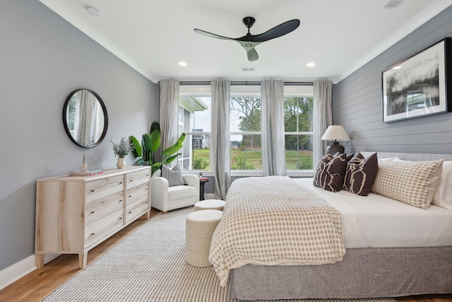 bedroom featuring crown molding, ceiling fan, baseboards, recessed lighting, and wood finished floors