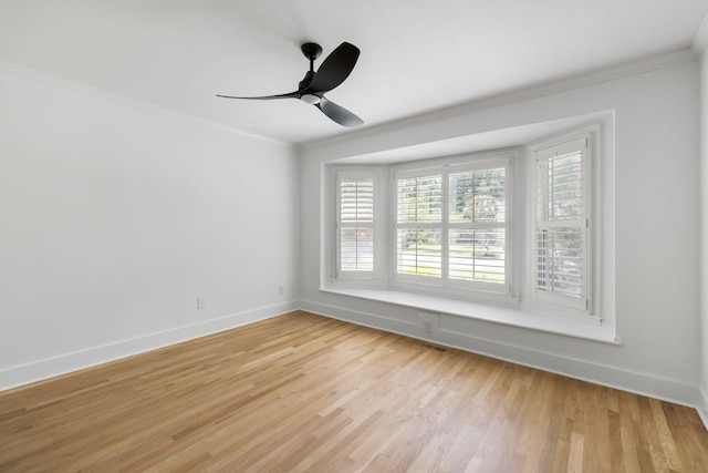 1019 Royalist Rd, Mount Pleasant, SC 29464 - unfurnished room featuring crown molding, light wood-style flooring, baseboards, and ceiling fan