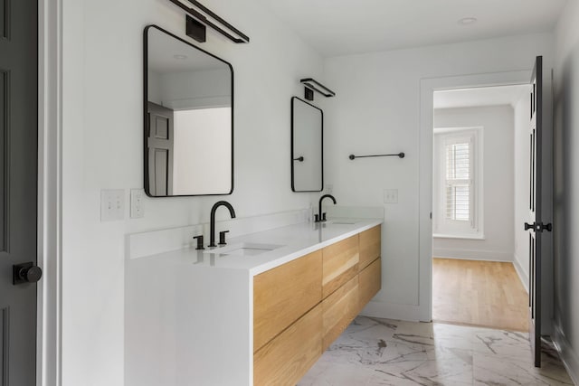 1019 Royalist Rd, Mount Pleasant, SC 29464 - full bathroom featuring marble finish floors, baseboards, and double vanity