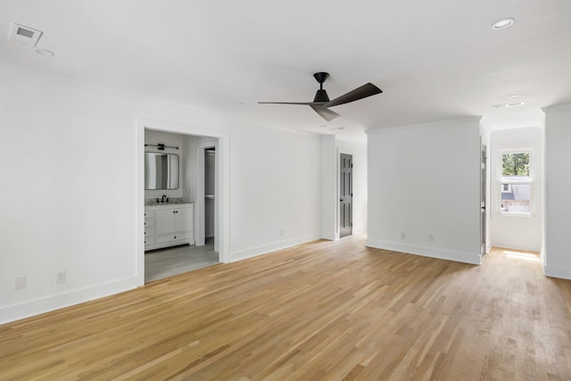 1019 Royalist Rd, Mount Pleasant, SC 29464 - unfurnished living room featuring crown molding, light wood-style flooring, baseboards, ceiling fan, and recessed lighting