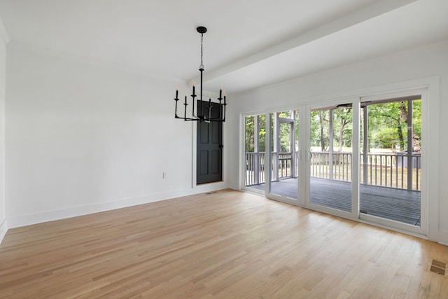1019 Royalist Rd, Mount Pleasant, SC 29464 - empty room with a chandelier, light wood finished floors, baseboards, and ornamental molding