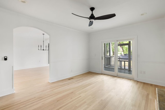 1019 Royalist Rd, Mount Pleasant, SC 29464 - spare room featuring crown molding, light wood-type flooring, a ceiling fan, arched walkways, and baseboards