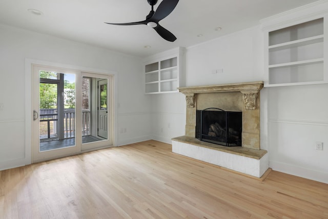 1019 Royalist Rd, Mount Pleasant, SC 29464 - unfurnished living room with wood finished floors, a ceiling fan, a fireplace, crown molding, and baseboards